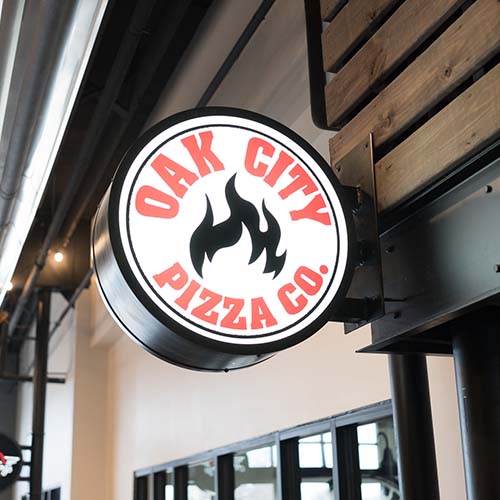 Oak City Pizza Sign Outside Restaurant