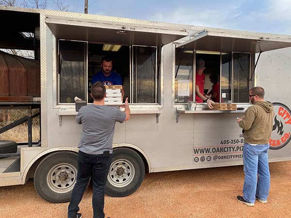 Oak City Pizza Food Truck Customers Picking up Order